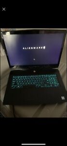 Alienware M17 Laptop with charger and backpack.