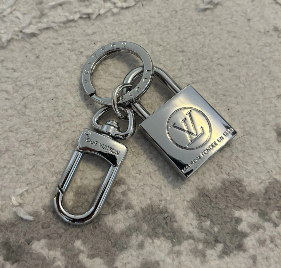 Louis Vuitton LV Logo Lock Key Ring Silver Pre-Owned - Image 1 of 3