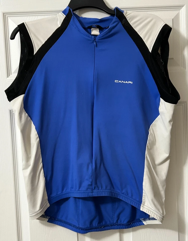 Impresionante Jersey de Ciclismo Canari Para Hombre Azul/Blanco/Negro Sin Mangas Usado en Excelente Condición 3/4 Cremallera Foto 1 de 3