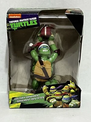 Nickelodeon Teenage Mutant Ninja Turtles Leonardo azul sosteniendo adorno de regalo Foto 1 de 4