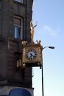 Photo 6x4 Keeping time Newcastle upon Tyne Clock and figure on corner of  c2008