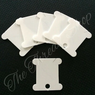 50 WHITE PLASTIC BOBBINS - useful for storing cross stitch/embroidery threads
