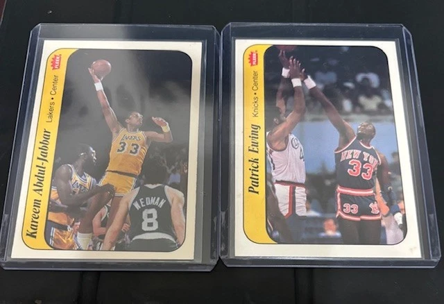 1986-87 Fleer Sticker Set-Break # 1 Kareem Abdul-Jabbar & # 6 Patrick Ewing - Image 1 of 1