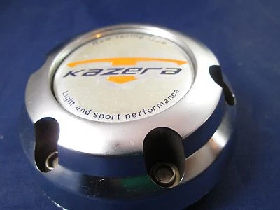 TAPA CENTRAL DE RUEDA PERSONALIZADA KAZERA PLATA/ORO* #NX-08.10.27-W (PARA 1 TAPA) Foto 1 de 4