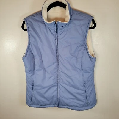 Chaleco reversible con cremallera Izod para mujer azul acolchado/marfil polar grande Foto 1 de 4