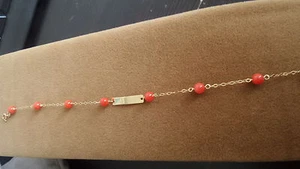 BRACCIALE NASCITA NEONATO BIMBO ORO GIALLO CORALLO INCISIONE NOME DATA GRATIS - Foto 1 di 1