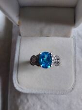 Oval Blue Topaz Ring with Accents