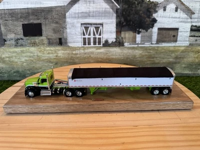 1/64 Scale DCP Kenworth W990 Day Cab &  Wilson Tandem Axle Grain Hopper Trailer - Image 1 of 4
