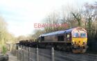PHOTO  CLASS 66 66 230 LLANWERN-MARGAM STEEL AT ST FAGANS LC - THE SMALL CABIN A