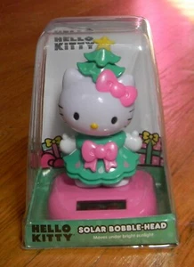 NIB Hello Kitty Christmas Tree Solar Powered Car Desk Table Bobble-Head Sario - Picture 1 of 4
