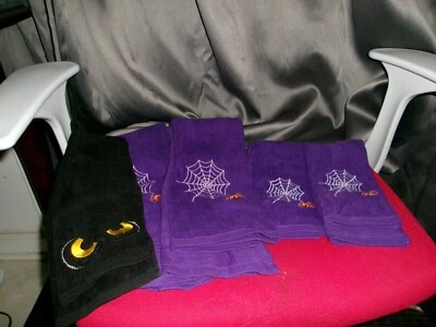 Halloween 3 hand  towels and 2 wash cloths, one is black and 4 are purple - Image 1 of 2