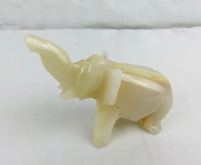 Vintage Hand Carved Amber Onyx Elephant Figurine Marble Stone Raised Trunk 3” - Image 1 of 4