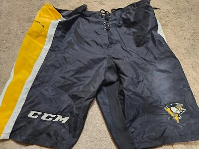 Pantalón de hockey PITTSBURGH PENGUINS CCM PP10 Pro Stock conchas usado en juego XL +1 Foto 1 de 4