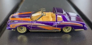 Loose 2001 Mattel HOT WHEELS purple w/orange design MONTEZOOMA gold chassis - Picture 1 of 7
