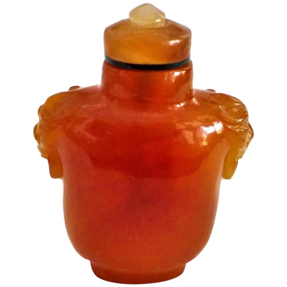 Cabeza de león tallada cornalina china vintage con anillo en la boca botella de tabaco y tapa Foto 1 de 4