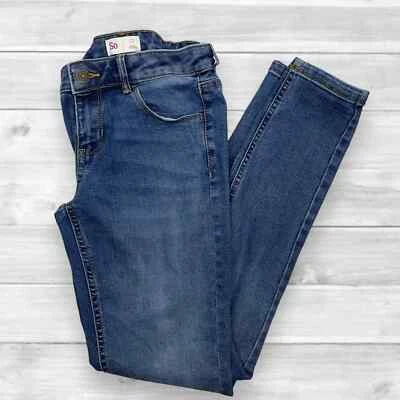 Pantalones de mezclilla So Jeans para niña tiro bajo ajustados lavado medio - talla 12 Foto 1 de 4