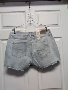 Levi  Women 14  Blue Jean Shorts  NW T   Cutoffs Frayed  Distressed Stretchy  - Picture 1 of 9
