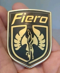 Pontiac FIERO 84-85 Metallic Front Header Bumper Badge DLA-14204 GOLD Frame - Picture 1 of 4