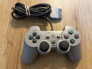 Controlador de choque doble Sony PlayStation PS1 PS2 gris SCPH-1200 FABRICANTE DE EQUIPOS ORIGINALES probado en funcionamiento - Imagen 1 de 1