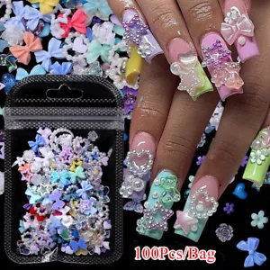 100 PIEZAS Dijes de uñas de resina 3D perlas pedrería gemas arco corazón estrella oso flores - Imagen 1 de 18