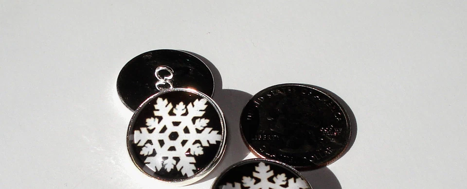 Snowflakes on Black 1 Glass Dome Button handcrafted collectible shank  - Image 1 of 1