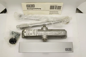 GEZE TS 2003 cierrapuertas cremallera plata L / R NUEVO en embalaje original - Imagen 1 de 8