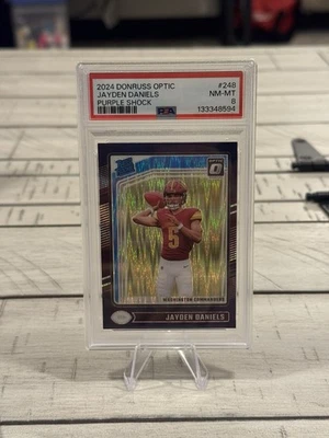 2024 Donruss Optic Jayden Daniel’s Purple Shock PSA 8 NEAR MINT - Image 1 of 2