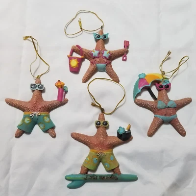 Lote De 4 Estrellas De Mar Tropicales Navidad Navidad Adornos 2 Niños 2 Niñas Surfista Playa Foto 1 de 4