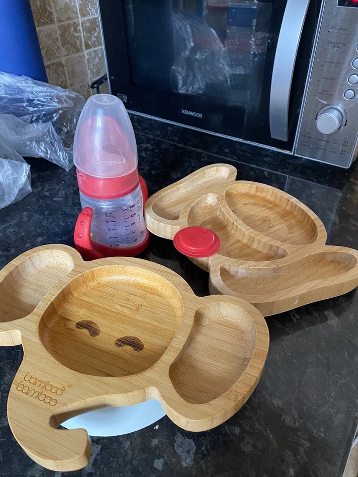 2x Platos de Bambú - Forma de Elefante y Perro + Paquete de Botella de Agua NUK - Buen Estado Foto 1 de 1