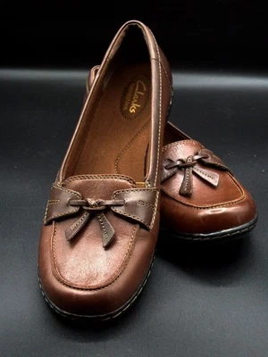Mocasín Clarks de cuero flexible para mujer 9 1/2 M sin cordones marrón castaño lazos nuevo Foto 1 de 4