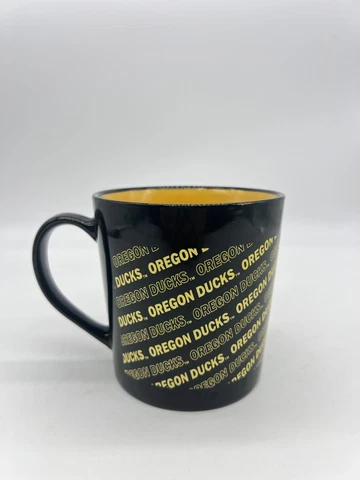 University of OREGON DUCKS Logo Mug Black Yellow RFSJ Inc Brand Cover