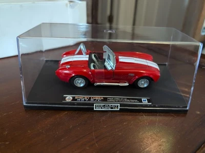 New Ray Shelby Cobra 427 S/C 1:32 Scale Red w/ White Stripes In Hard Case NOS - Image 1 of 3