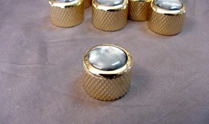 PERNO DE GUITARRA PUSH-ON DORADA CON PERLA GRIS - Imagen 1 de 4