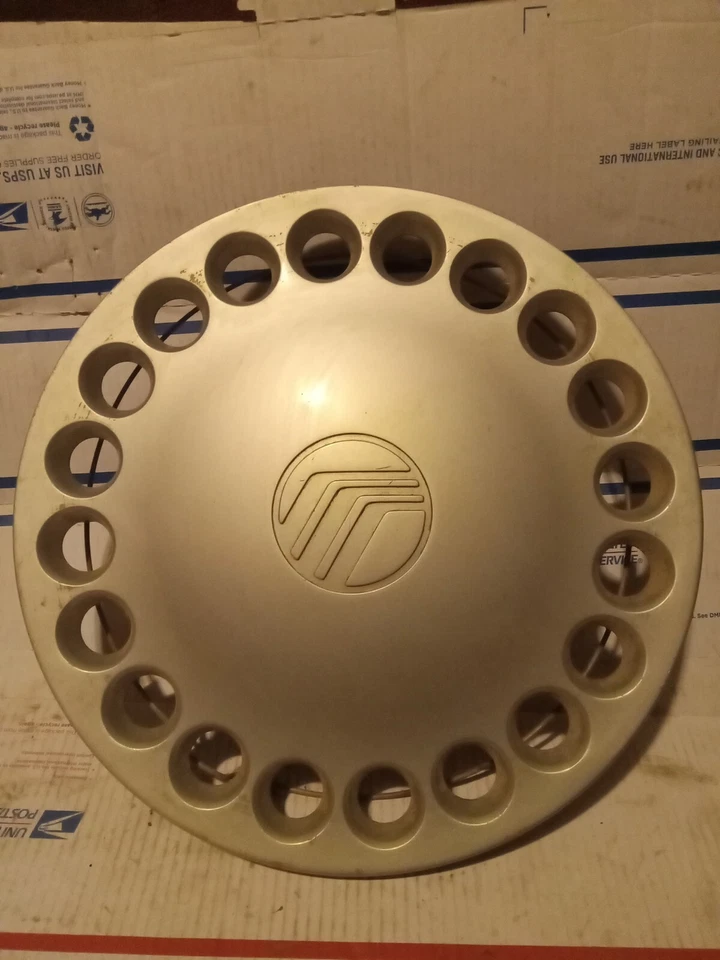 OEM 14 Inch Silver Hubcap, Wheel Cover 20 Holes Painted 98 Mercury Tracer - Image 1 of 4