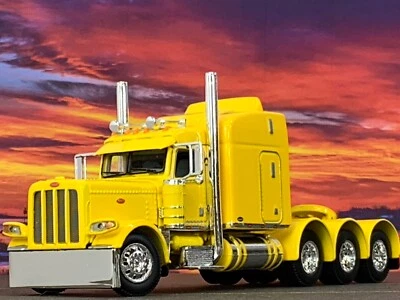 1/64 DCP YELLOW PETERBILT 389 TRI AXLE W/ 63" MID ROOF SLEEPER W/ WHALE TAIL - Image 1 of 4