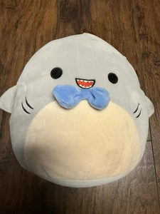 Gordon the Shark Squishmallow, specifically a version wearing a blue bowtie. - Picture 1 of 5