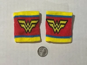 DC *WONDER WOMAN* SUPER HERO KIDS WRIST BANDS **QUARTER FOR SIZE SCALE** - Picture 1 of 1