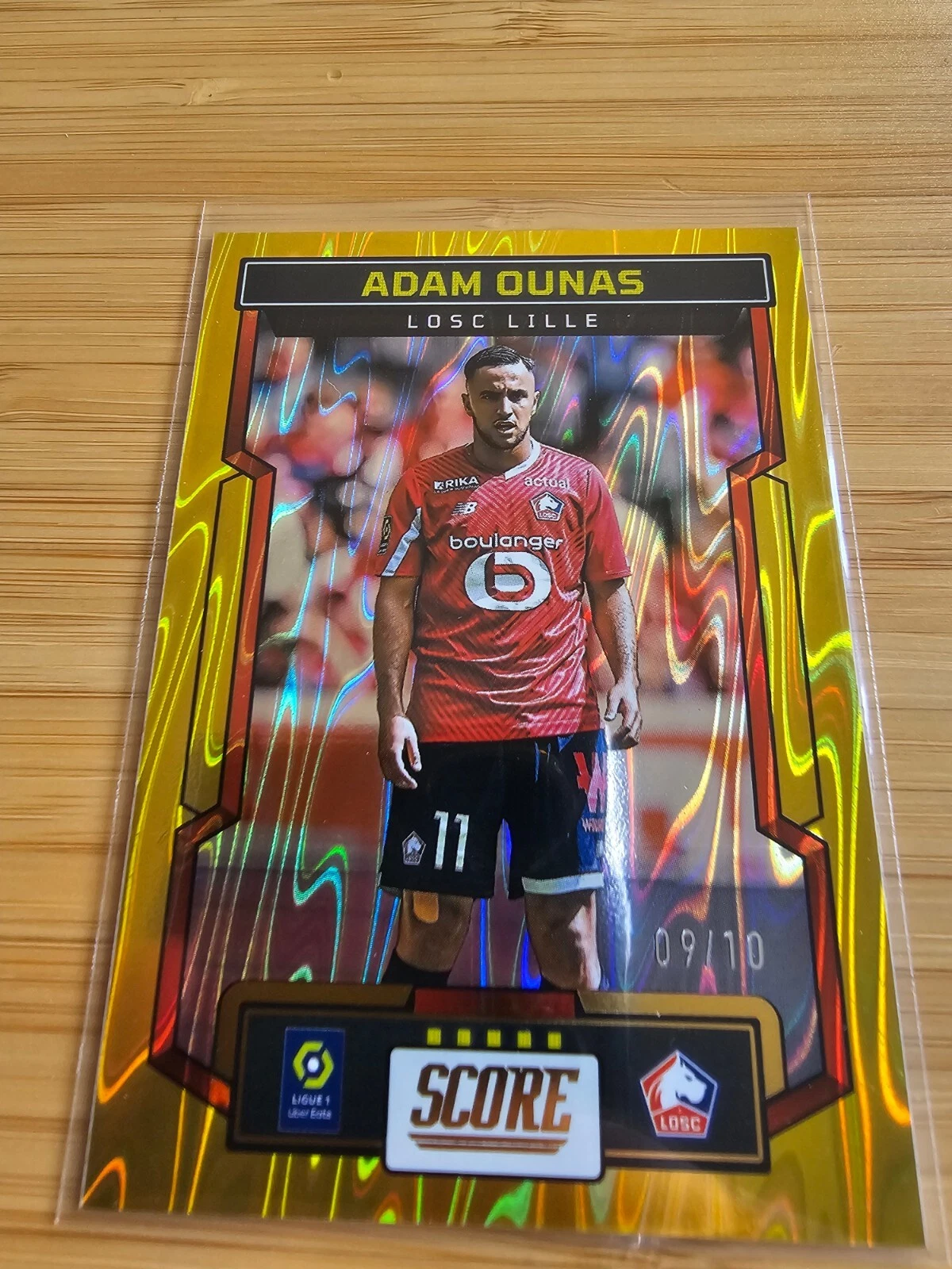 2023-24 Panini Score Ligue 1 Adam Ounas 09/10 Gold Swirl Lille