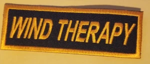 WIND THERAPY Embroidered Patch approx 1.25X3.75" orange - Picture 1 of 2