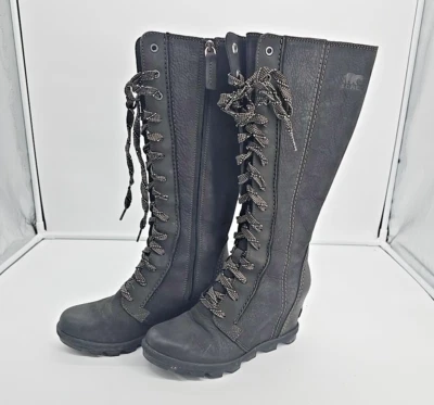 Botas hasta la rodilla Sorel Joan of Arctic de cuero negro, cuña alta, con cordones 7,5  Foto 1 de 4