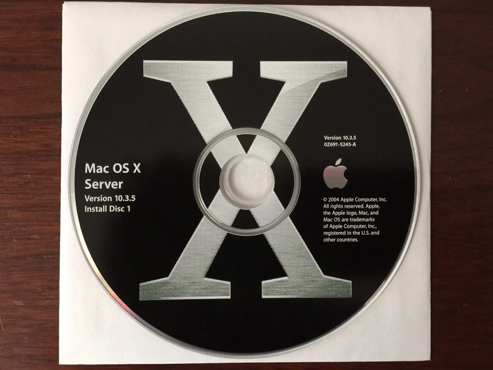 Apple Mac OS X Server 10.3 with unlimited clients key, Original 4 CD set w/Docs - Image 1 of 4
