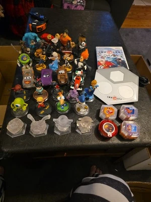 Disney Infinity Wii Lote: 27 Figuras, 4 Cristales, Discos de Potencia, Juego y Portal Foto 1 de 4