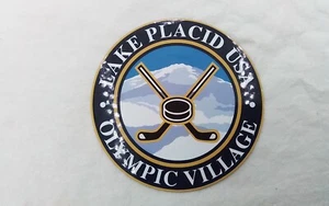 LAKE PLACID USA OLYMPIC VILLAGE HOCKEY STICK PUCK VINTAGE SOUVENIR FRIDGE MAGNET - Picture 1 of 11