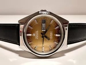 "VINTAGE SELTENE SCHÖNE SCHWEIZER GANZSTAHL HERREN AUTOMATIK TAGESDATUM UHR ""DELMA" - Bild 1 von 10