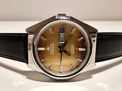 RELOJ SUIZO VINTAGE RARO HERMOSO TODO ACERO AUTOMÁTICO DÍA-FECHA PARA HOMBRE "DELMA"  Foto 1 de 4