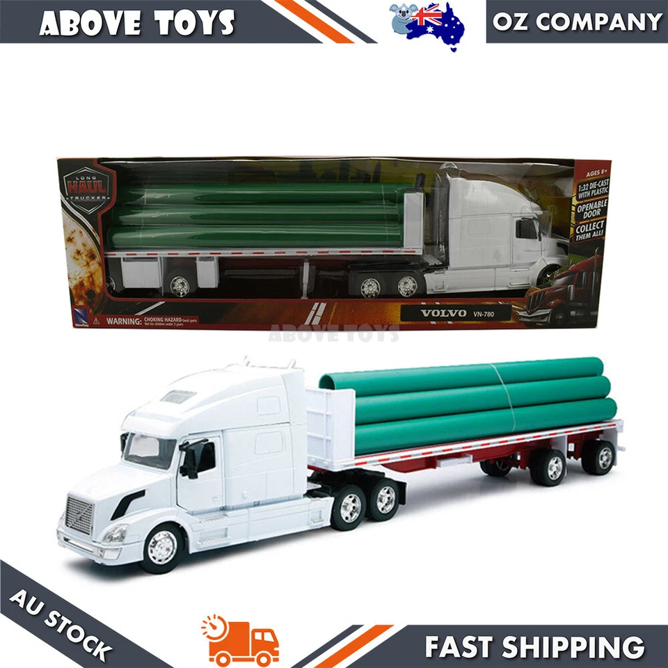 New Ray 1:32 Volvo VN-780 Flatbed Trailer With Long Pipe Diecast Truck Model - Image 1 of 3