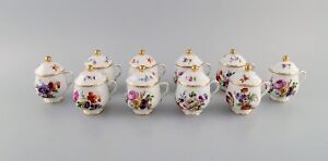 10 antique Rörstrand porcelain cream cups with hand-painted flowers.