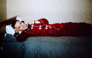 Slide 1950's US Army Soldier Silk Pajamas Laying on Bed Calling Home Korean War - Picture 1 of 3