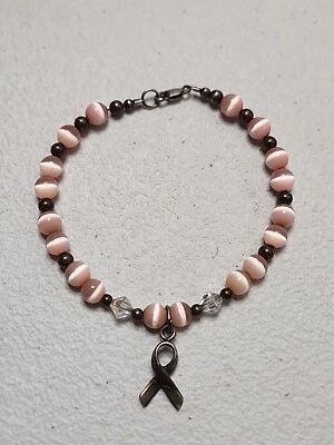 Pulsera de plata esterlina ojo de gato rosa ojo de gato 7,5" concienciación sobre el cáncer  Foto 1 de 4