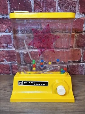 DE COLECCIÓN 1976 TOMY WATERFUL STARBALL BOLA LANZAMIENTO JUGUETE ACUÁTICO PORTÁTIL JUEGO AMARILLO Foto 1 de 4